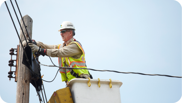 Image of a lineworker working on a pole