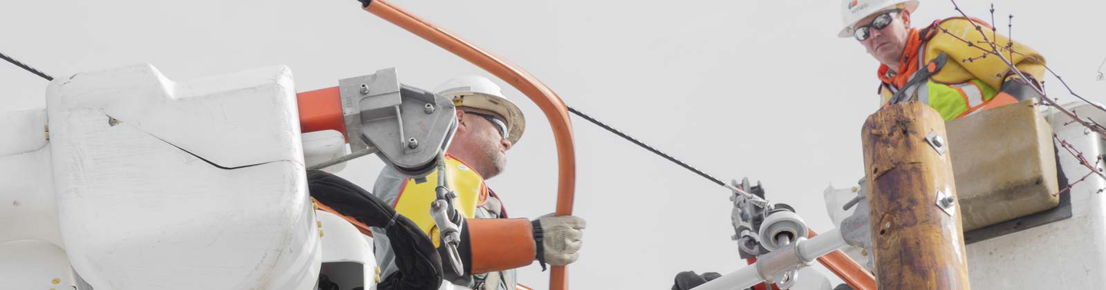 Linemen repairing power lines
